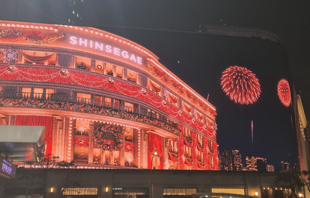 Shinsegae department store Christmas lights illuminating Seoul at night in December