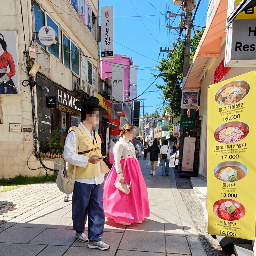 Visitors wearing hanbok on a street near Gyeongbokgung Palace