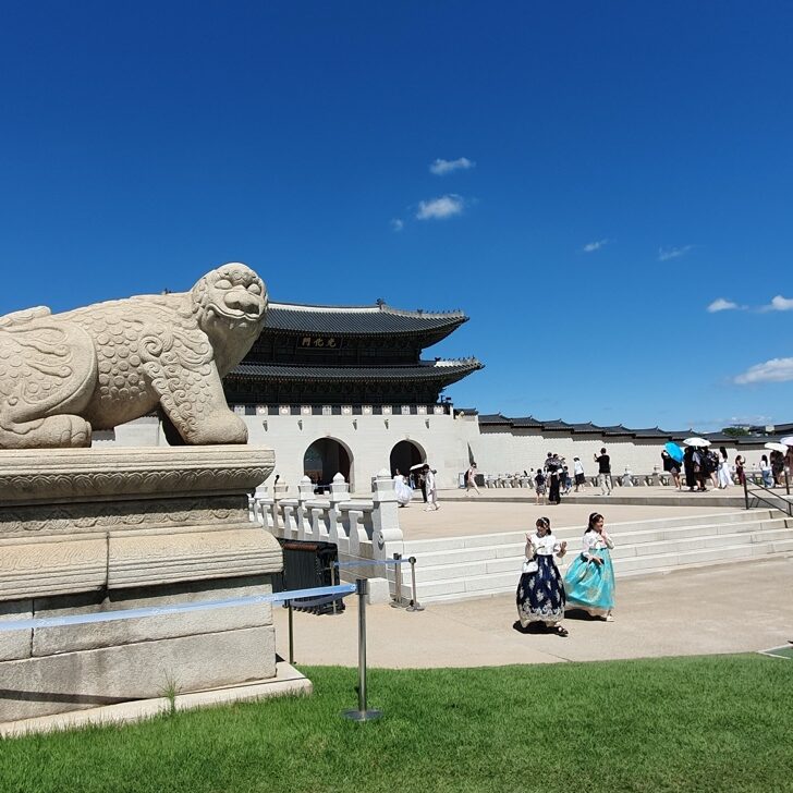 Gyeongbokgung Palace with visitors wearing hanbok in Seoul