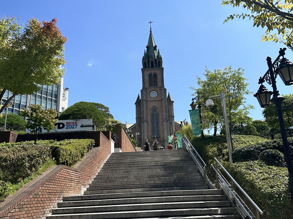Myeongdong Cathedral surrounded by autumn trees in Seoul