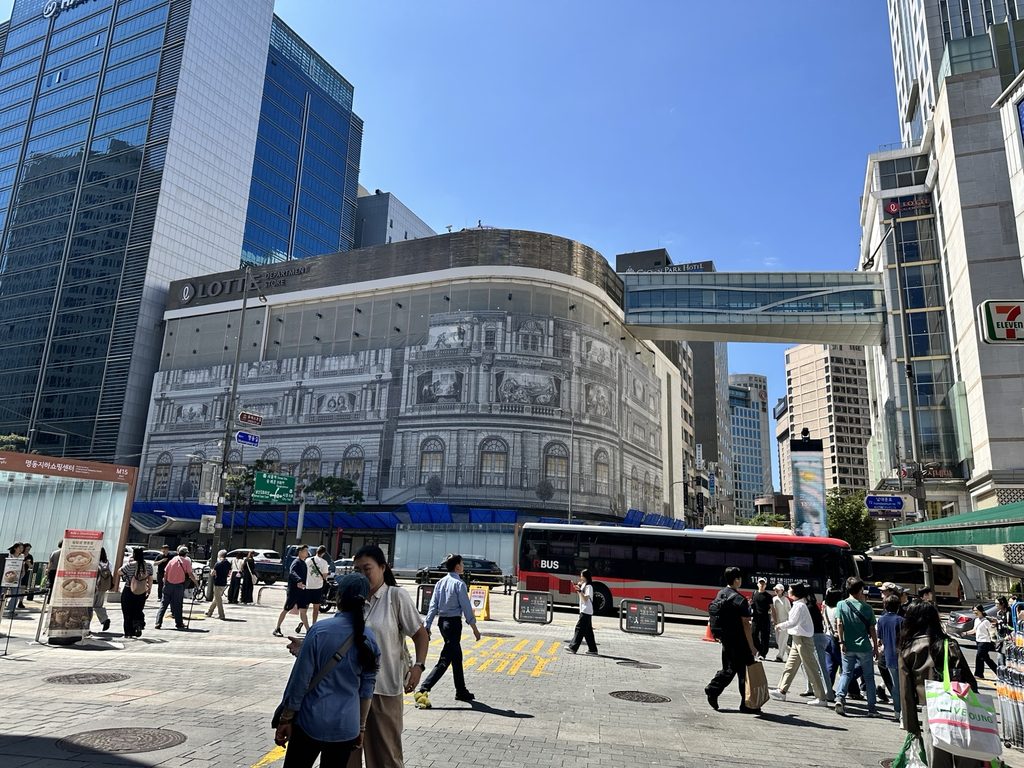 Busy intersection and shopping streets in Myeongdong, Seoul