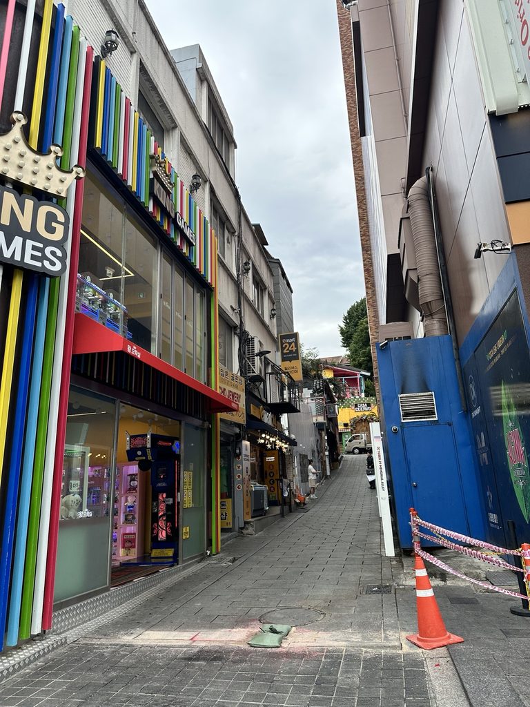 Colorful shops along a narrow street in Itaewon, Seoul
