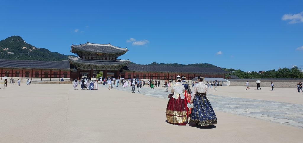 Visitors wearing hanbok inside Gyeongbokgung Palace in Seoul